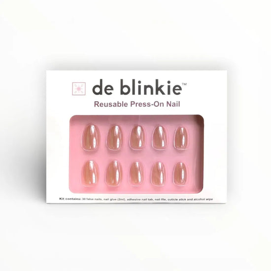 de blinkie Barely Mocha reusable press-on nail kit box showing 10 short oval false nails with rosy mocha nude finish on pink tray against white background