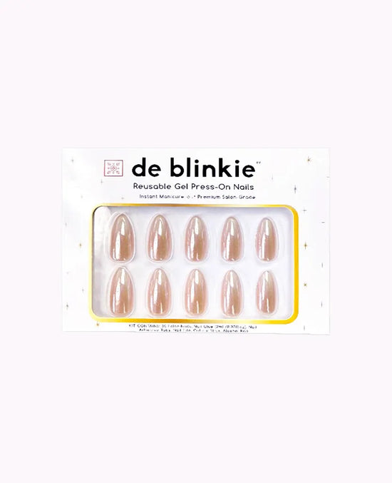Product box shot showing de blinkie Champagne Veil champagne gold glazed ombre medium almond press-on nails against pink background