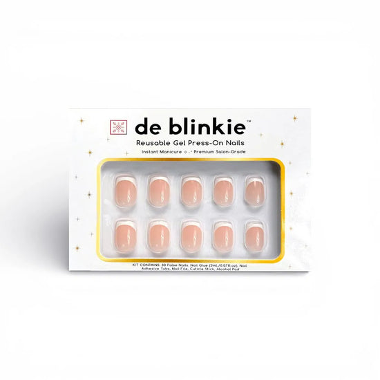 Box shot of de blinkie Chic Classique reusable gel press-on nails in soft blush nude and white French tip extra short square against a white background