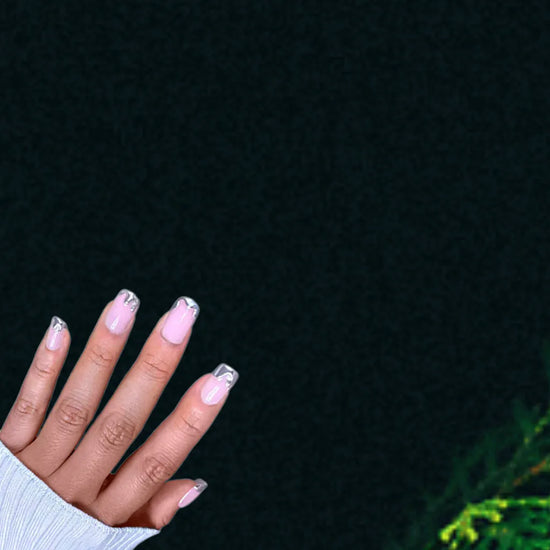 Fingers up pose showing de blinkie Chrome Whispers sheer blush pink with sculptural silver chrome tips in short square shape against dark background with white ribbed knit sleeve