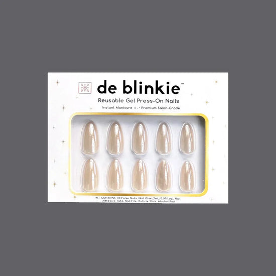 Box shot of de blinkie Creme Glazed reusable gel press-on nails in sheer milky cream glazed medium almond against a grey background