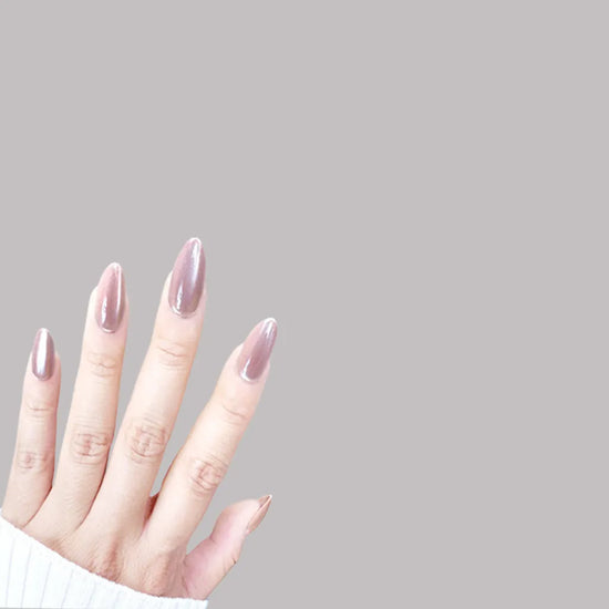 Upward spread hand showing de blinkie Dame Allure velvet mauve rose press-on nails in short almond against a soft grey background with a white ribbed knit sleeve