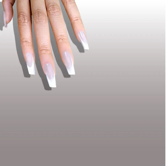 Fingers pointing downward showing de blinkie Frosted Beige nude pink frosted white press-on nails in short coffin against a cool grey gradient background