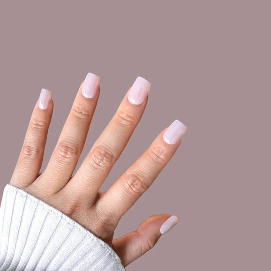 Fingers pointing upward showing Glazed Petal rose mauve blush glazed donut short square press-on nails against mauve background