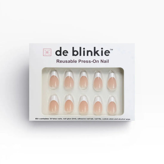 de blinkie La Belle Frenchie reusable press-on nail kit box showing 10 short coffin false nails with sheer blush pink base and white French tips on white tray against white background