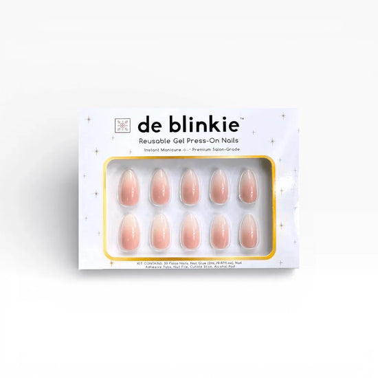 Box shot of de blinkie Lady Haze reusable gel press-on nails in blush pink to white ombre short almond against a white background