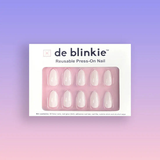 Product box showing de blinkie Lady Ivory creamy milky white press-on nails in medium oval shape against purple to pink gradient background