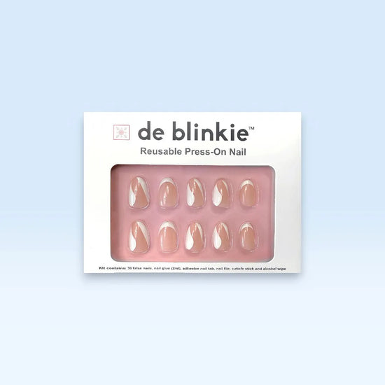 de blinkie Le Twist Blanc press-on nail kit box showing 10 short oval false nails with sheer pink nude base and white crescent, wave and fine line designs on white tray