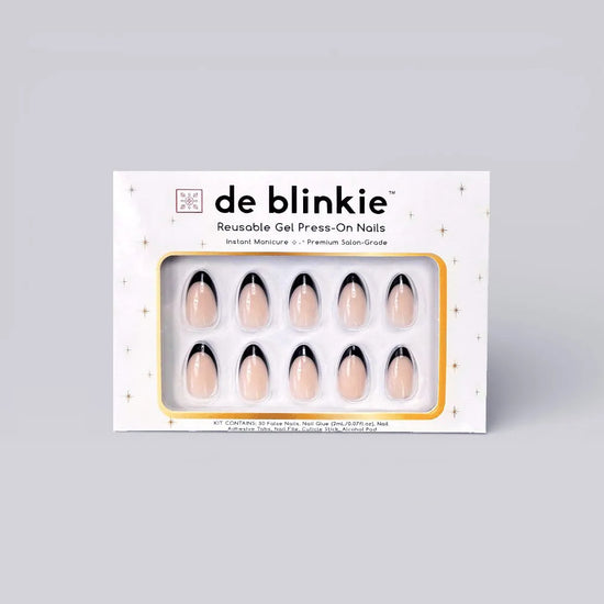 Product box shot of de blinkie Midnight Frenchie soft nude base with black French tip reusable gel press-on nails in short almond displayed in white branded packaging with gold star detailing against a soft grey background