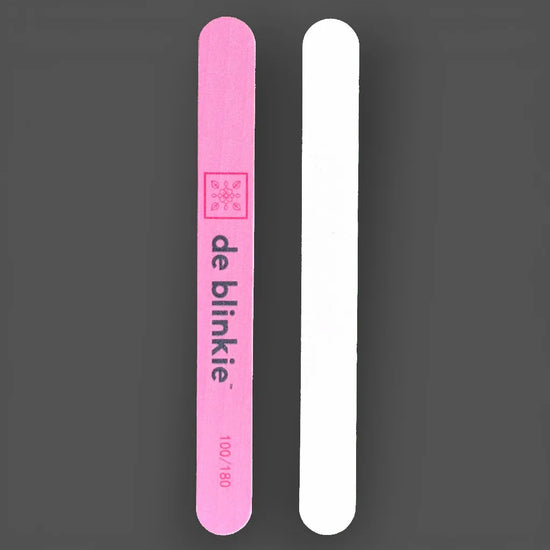 Front and back of de blinkie double-sided 100/180 grit straight nail file showing pink branded side and white side against a grey background