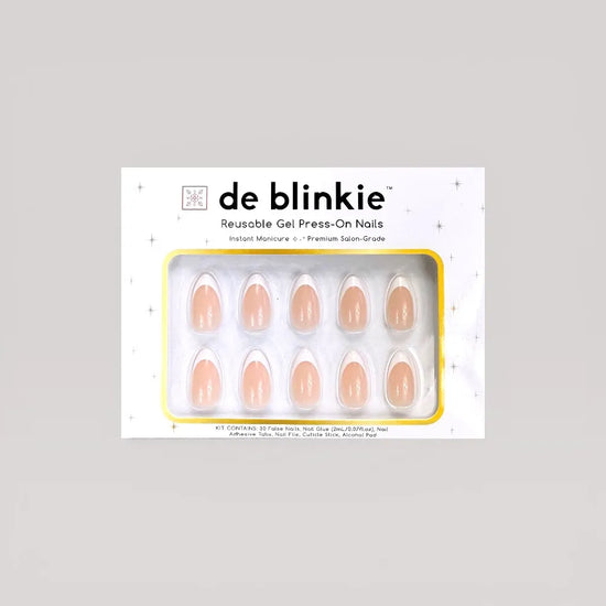 Box shot of de blinkie Parisienne Blanc reusable gel press-on nails in soft nude and white French tip short almond against a grey background