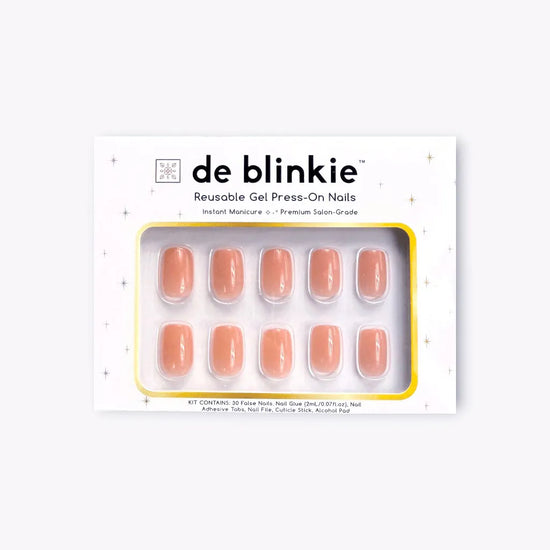 Box shot of de blinkie Peach Glow reusable gel press-on nails in soft peach nude jelly short square against a white background
