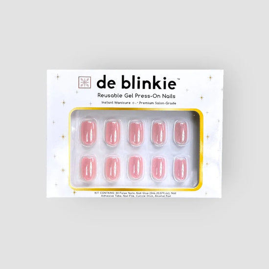 Box shot of de blinkie Pink Glimmer reusable gel press-on nails in soft bubblegum pink glazed short square against a light grey background