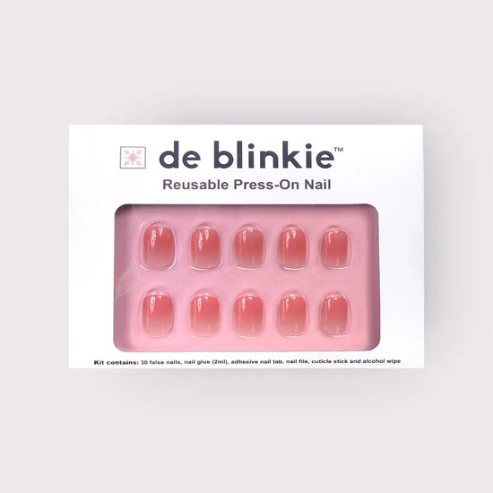 de blinkie Rosé Jelly reusable press-on nail kit box showing 10 extra short squoval false nails with sheer warm rose ombre jelly finish on pink tray