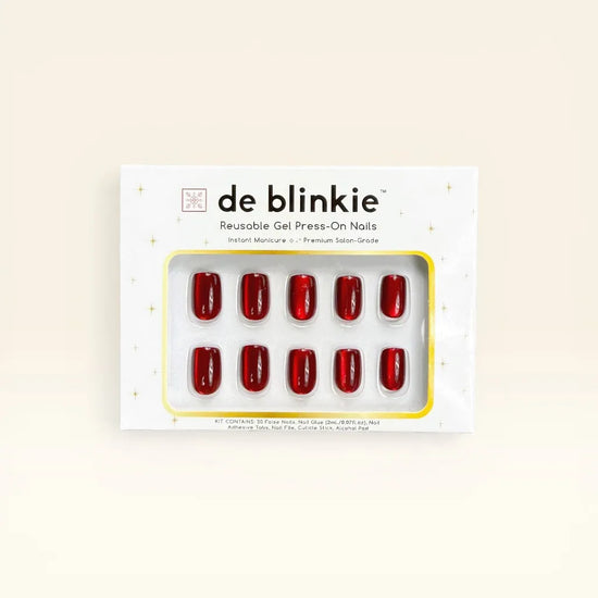 Product box shot showing de blinkie Scarlet Luxe scarlet red mirror chrome short square press-on nails against cream background