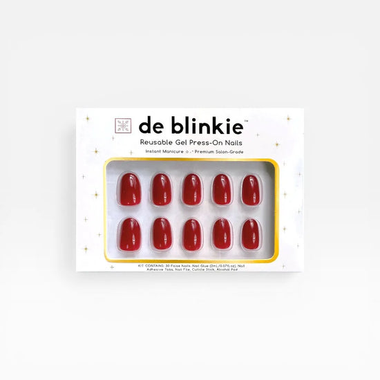 Product box shot showing de blinkie Scarlet Muse classic crimson gloss short oval press-on nails against a white background