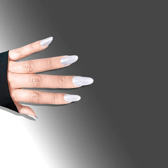 Fingers pointing downward showing de blinkie Silver Glint pearl white pearlescent press-on nails in short almond