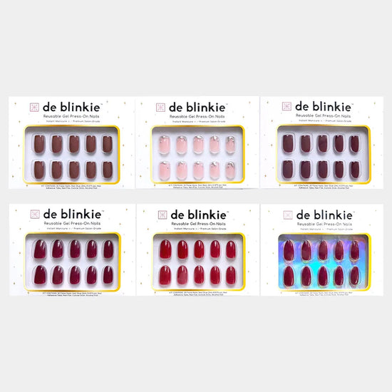 Box shot showing all six de blinkie The Velvet Edit velvet noir gel press-on nail styles against a white background