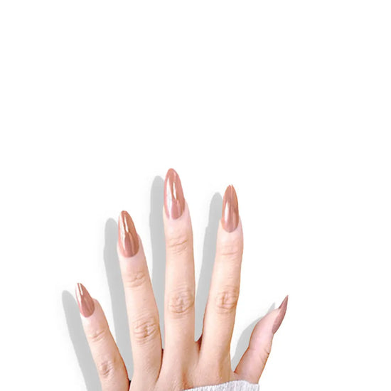 Fingers pointing upward showing de blinkie Toffee Glazed warm caramel glazed gloss press-on nails in medium almond