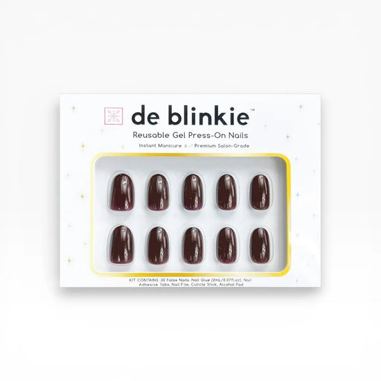 Product box shot showing de blinkie Velvet Noir dark bordeaux gloss short oval press-on nails against white background